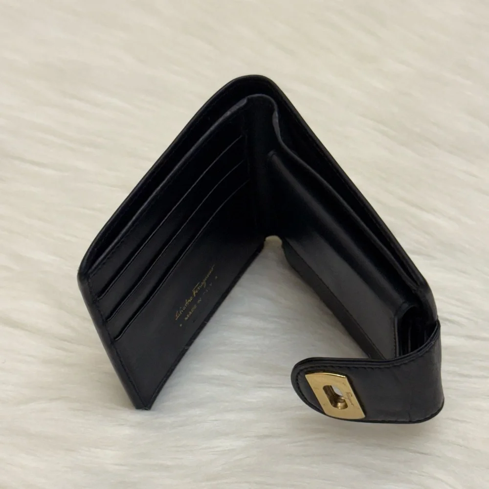 SALVATORE FERRAGAMO - BLACK LEATHER GOLD PLATED SECURE CLOSURE BIFOLD WALLET